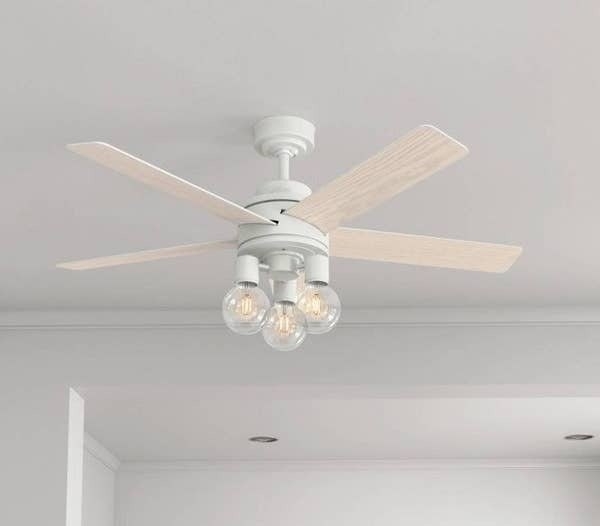 The white remote-controlled multi-bulb ceiling fan
