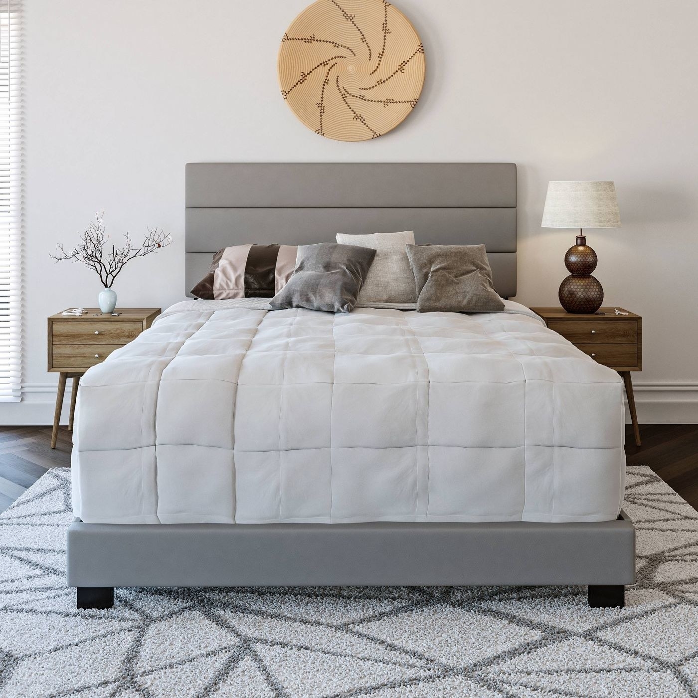 The gray faux leather upholstered platform bed