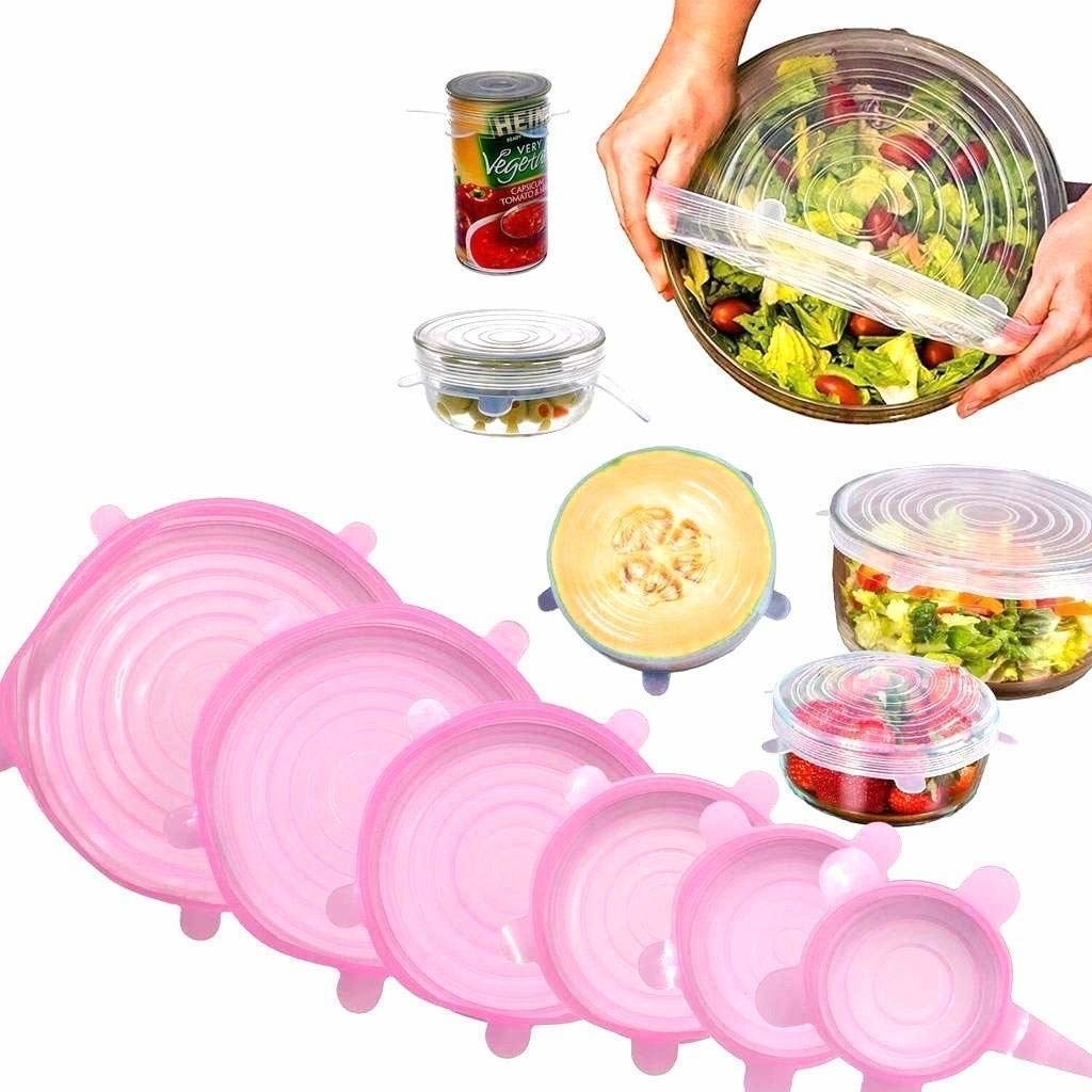 A person using the silicone lids to cover bowls and half cut fruits