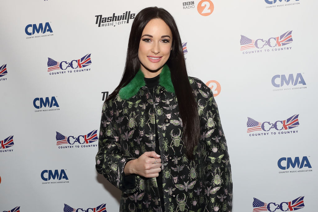 Kacey Musgraves wearing Red Valentino coat poses during a photocall on day 2 of C2C Country to Country festival