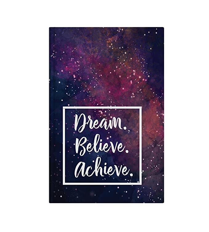 A galaxy print notebook with the words &#x27;Dream. Believe. Achieve.&#x27; on it