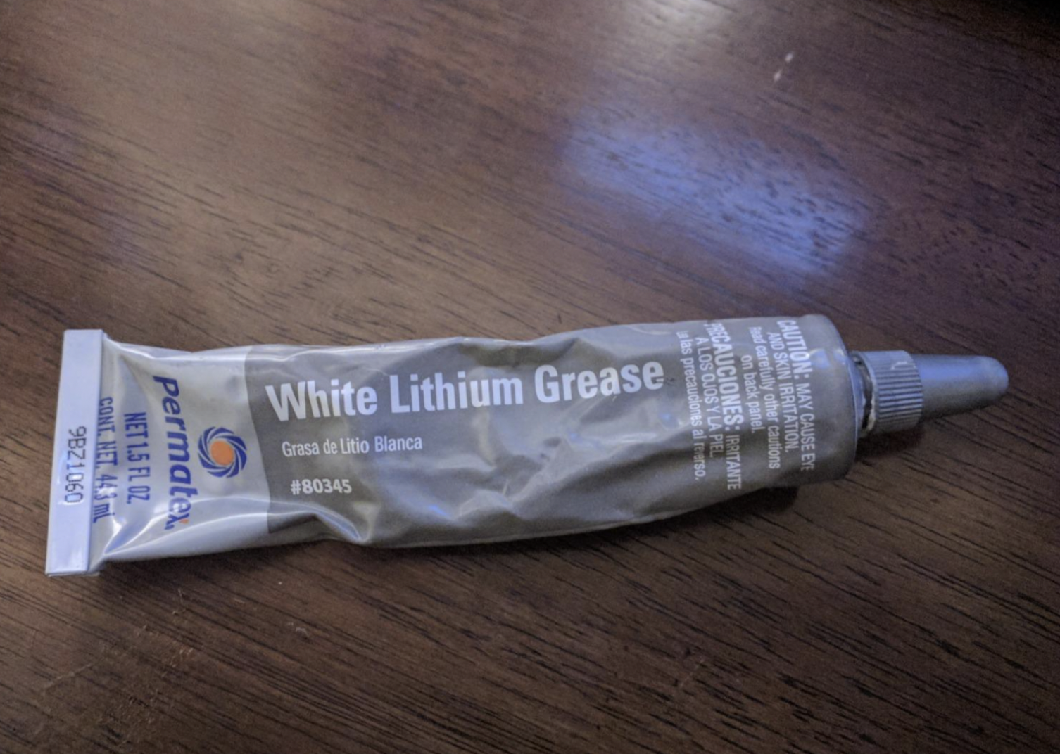 Reviewer image of small tube of white lithium grease