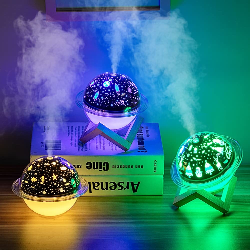 Night lamps that look like planets and give off different coloured lights an spurt mist from the middle