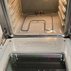 reviewer after image of the same oven spotlessly clean