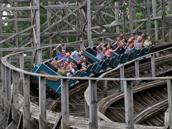 amusement park with wooden roller coaster