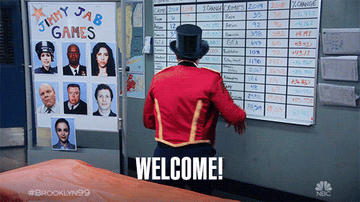 a gif of Joe Truglio in &quot;Brooklyn Nine-Nine&quot; turning around and saying &quot;welcome&quot;