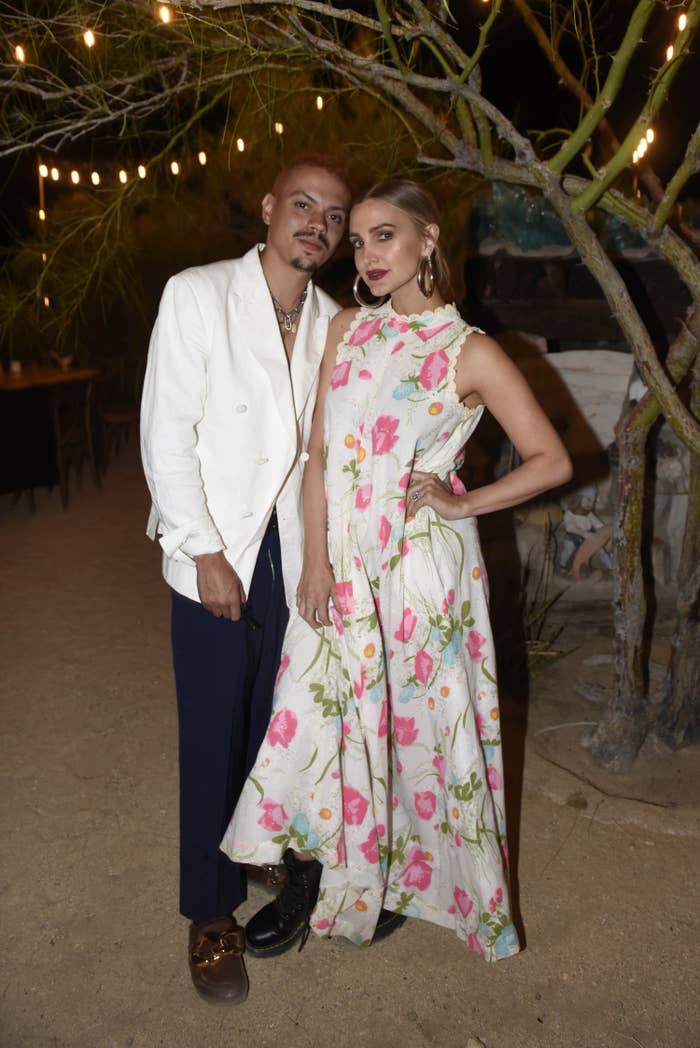 Evan Ross, in a suit, and Ashlee Simpson, in a floral gown, posing for a photo together