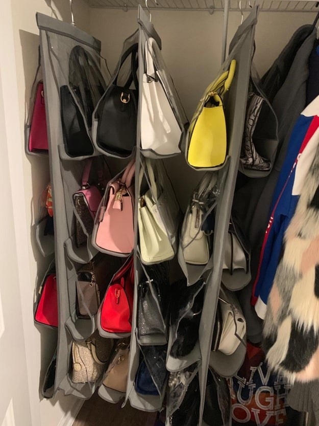 reviewer&#x27;s closet with three bag holders hanging up