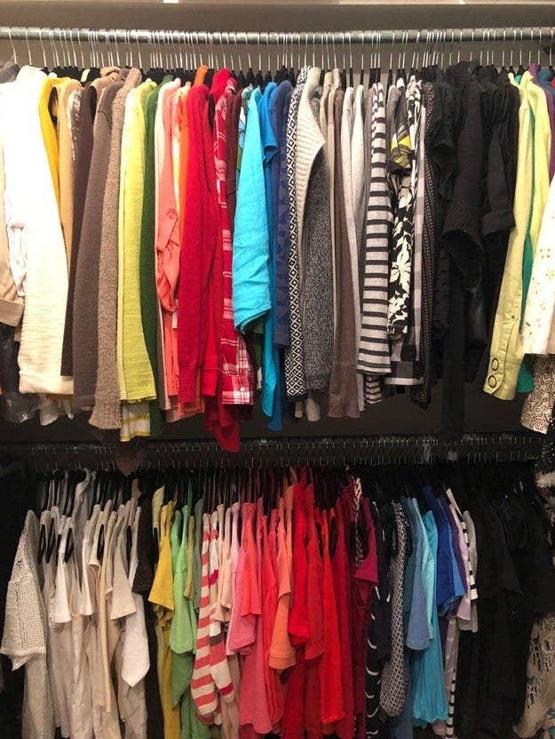 Reviewer&#x27;s closet with tons and tons of the velvet hangers fitting in to a closet