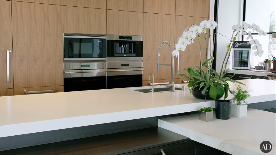 Another view of his spare kitchen with white counter space