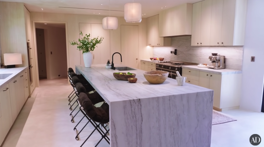 Another image of their spare kitchen, with a long island table