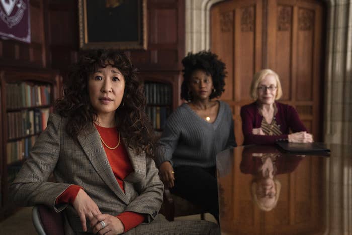 Sandra Oh, Nana Mensah, and Holland Taylor sitting at a table in The Chair