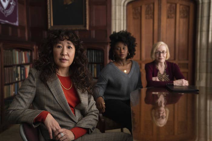 Sandra Oh, Nana Mensah, and Holland Taylor sitting at a table in The Chair