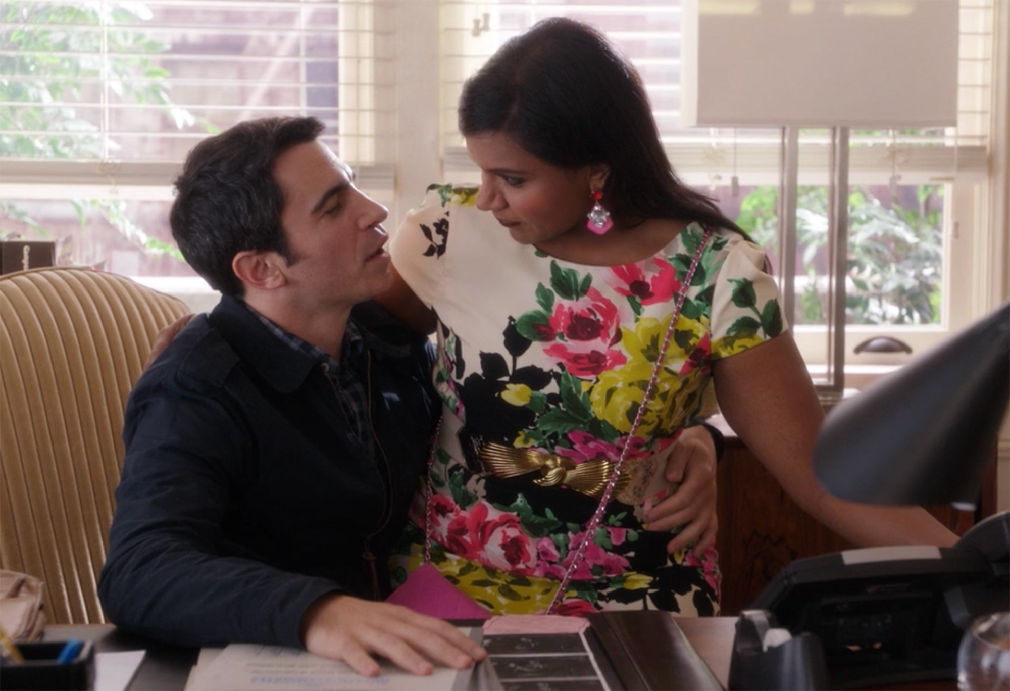 Mindy sits on Danny&#x27;s lap in his office