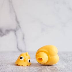 Chick-shaped vibrator with head removed to reveal suction tip