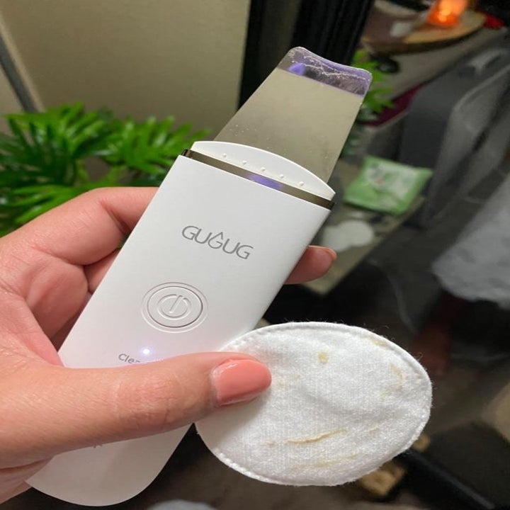 Reviewer holding product in hand