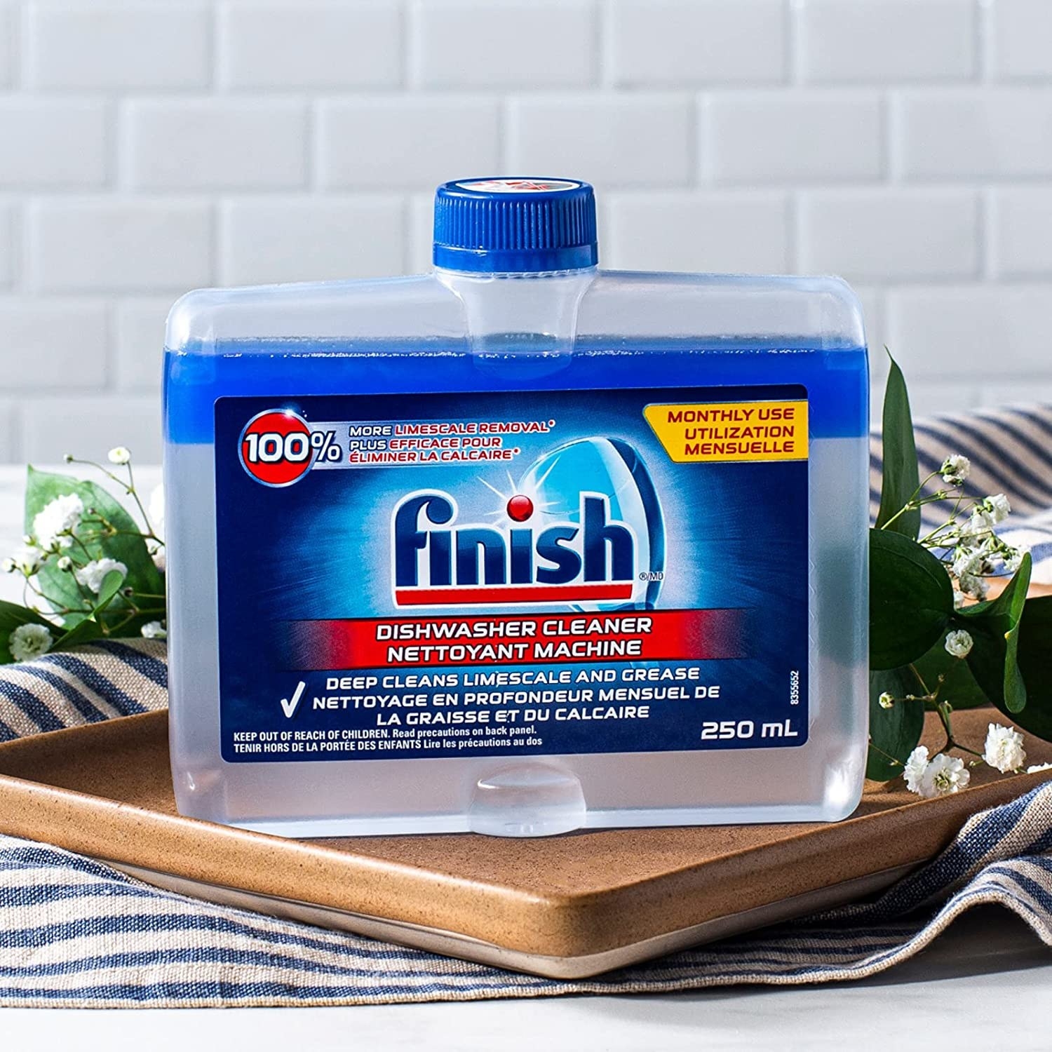 A bottle of dishwasher cleaner on a tray