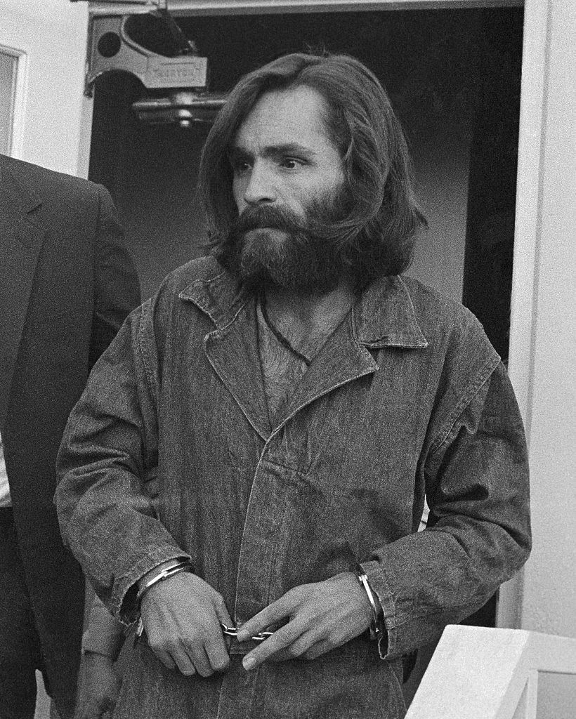 Charles Manson in handcuffs