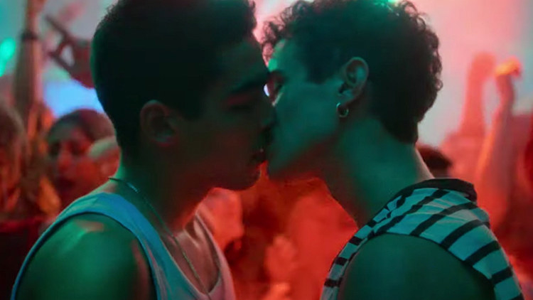 Omar and Ander share a passionate kiss as they stand in the middle of a crowded club dance floor