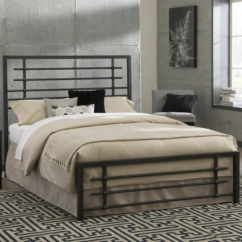 The bed with pillows and sheets on it in a bedroom