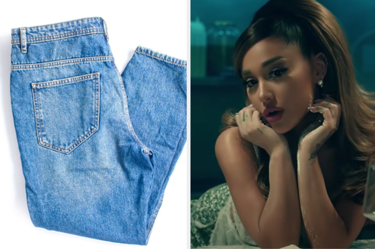 A pair of jeans are on the left folded with Ariana Grande leaning on her hands on the right