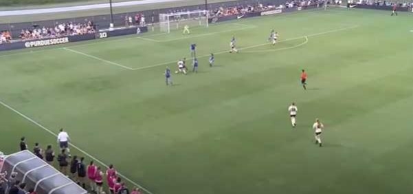 Sarah Griffith dribbles soccer ball toward goal
