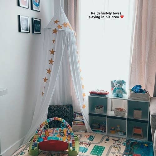 Reviewer's photo showing the white canvas canopy nook in their kid's play space