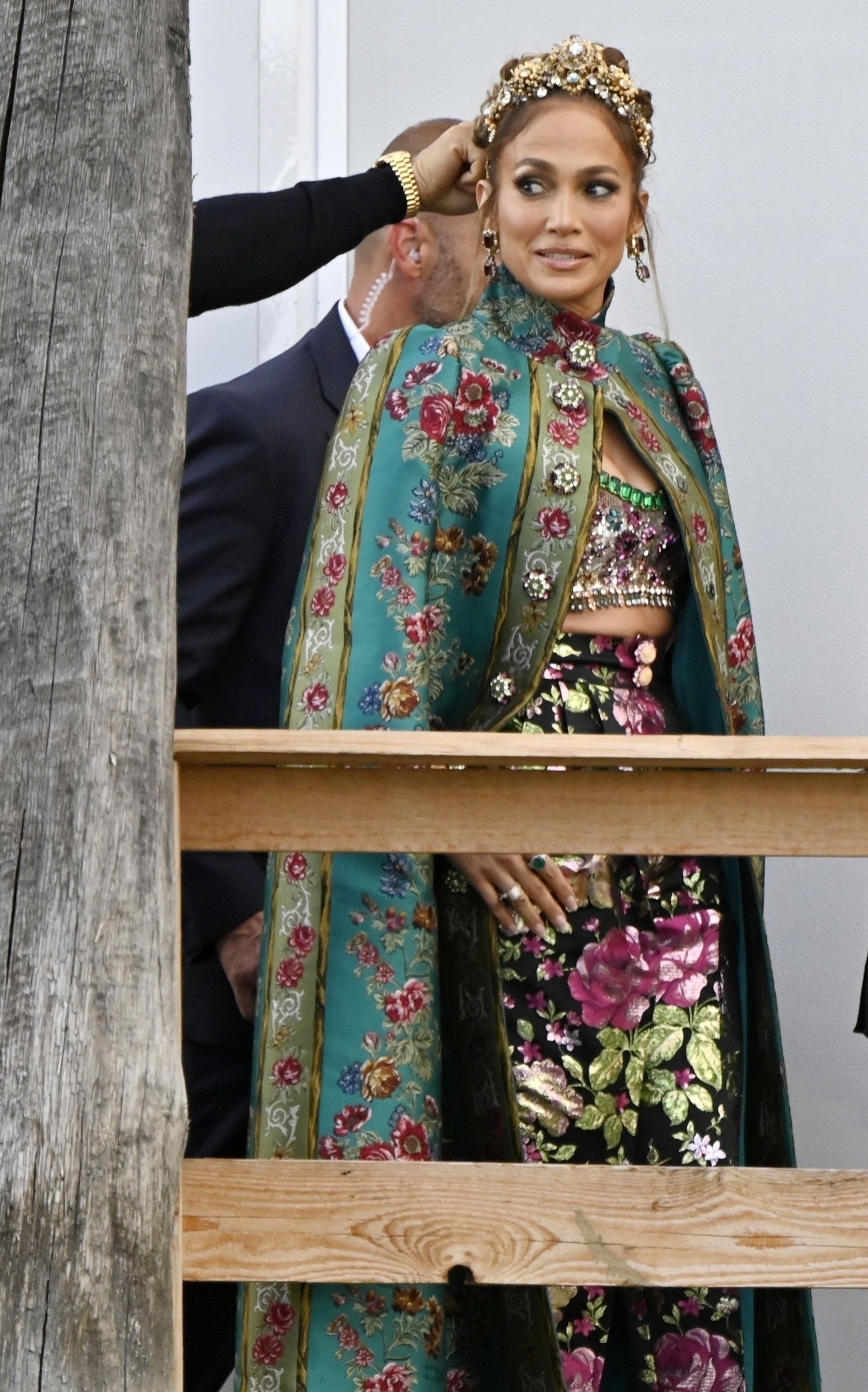 Jennifer wearing an ornate outfit and headpiece and looking surprised