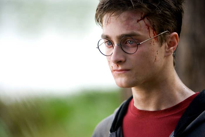 Radcliffe as Harry Potter with blood running down his temple