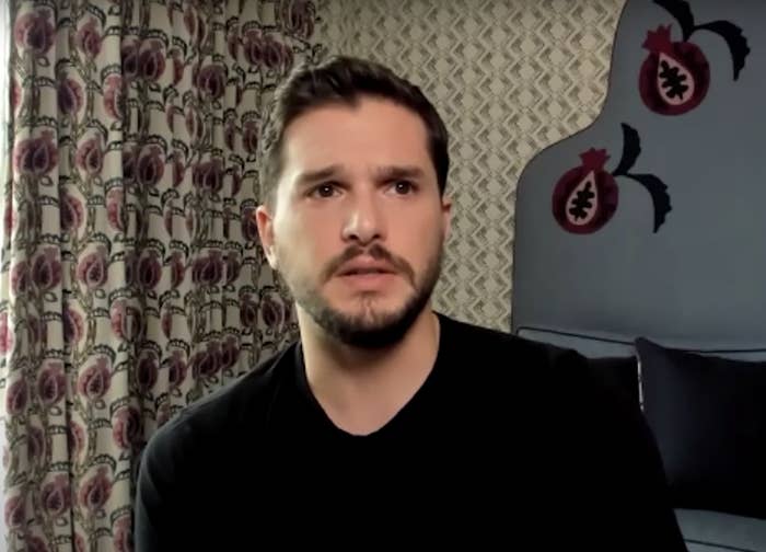 Kit looks into the distance in a screenshot from the interview