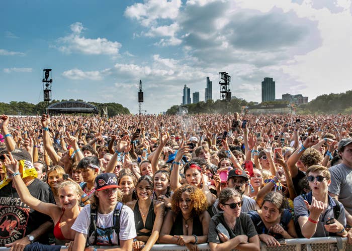 A huge crowd of people are pictured in Chicago&#x27;s Grant Park for Lollapalooza 2021