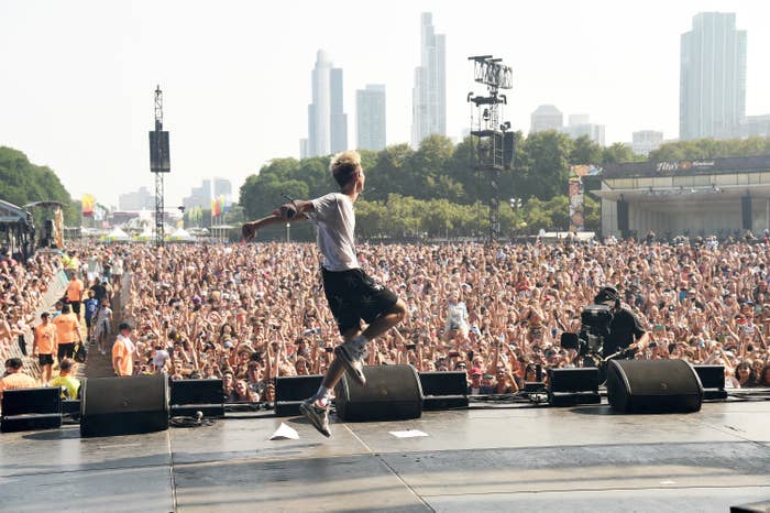 Jxdn performs onstage in front of a packed crowd at Lollapalooza 2021
