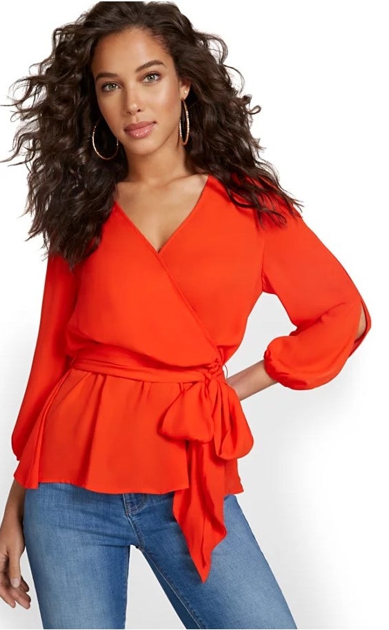 the wrap front peplum top in sweltering sunset