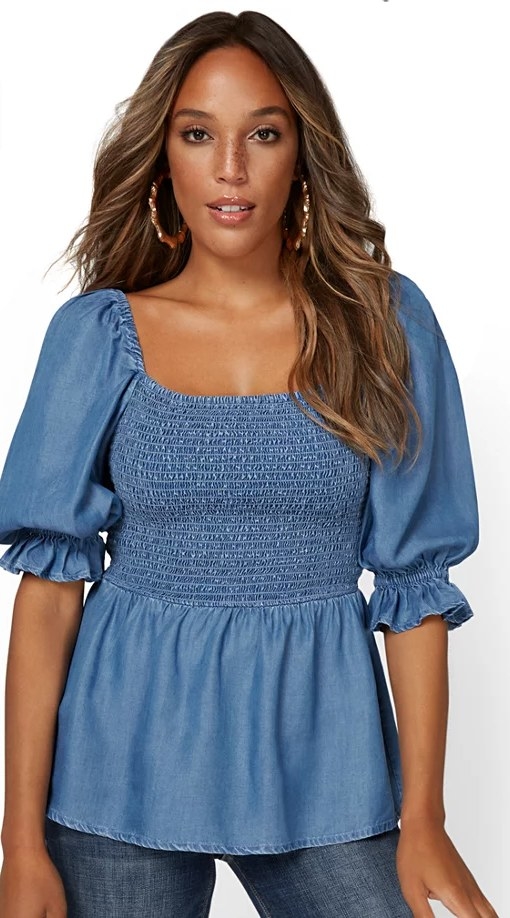 the smocked chambray top on a model