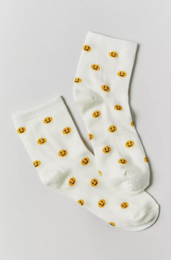 White crew socks with yellow smiley faces
