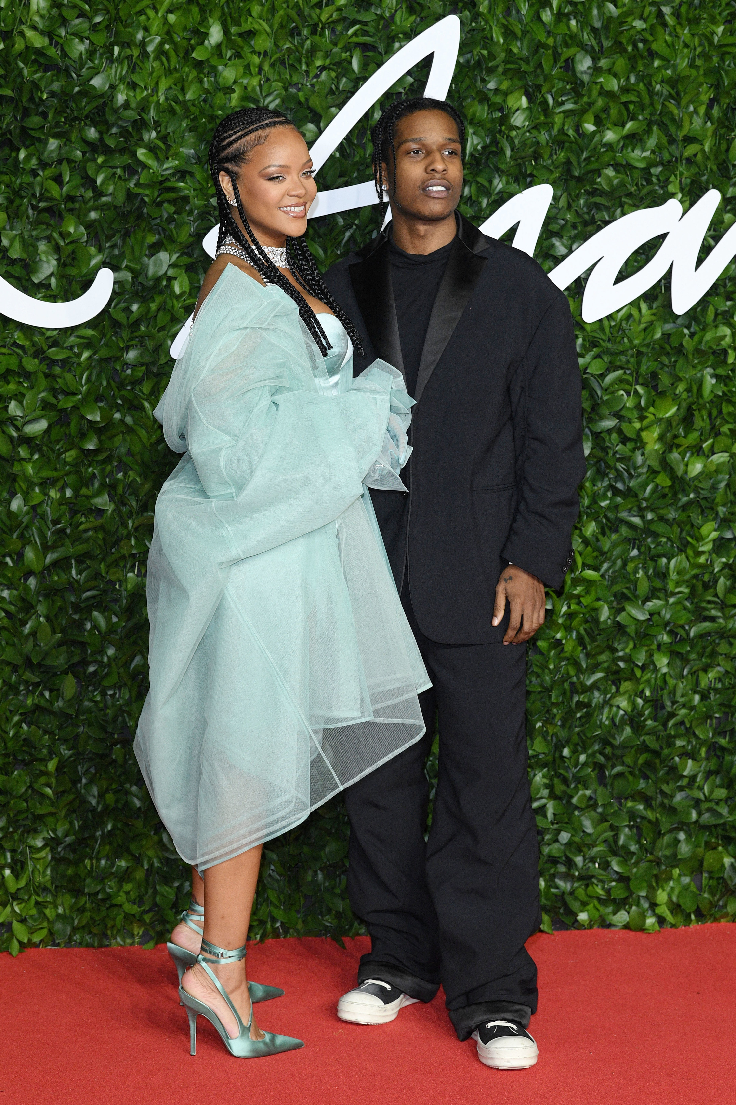 Rihanna and A$AP Rocky are pictured at a red carpet event in 2019