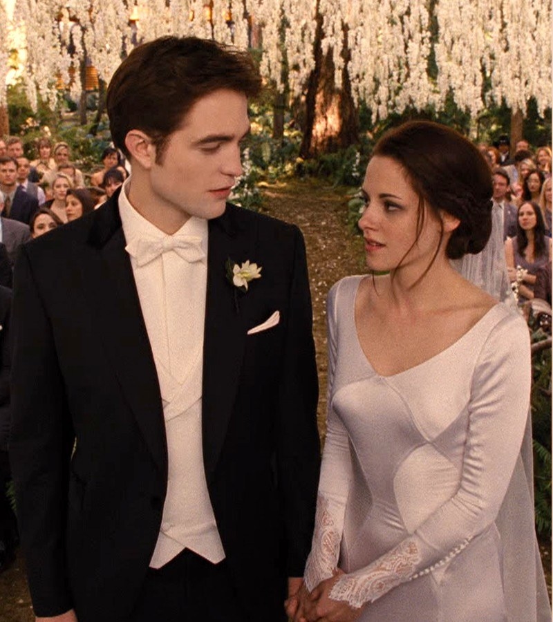 Edward and Bella standing at the alter