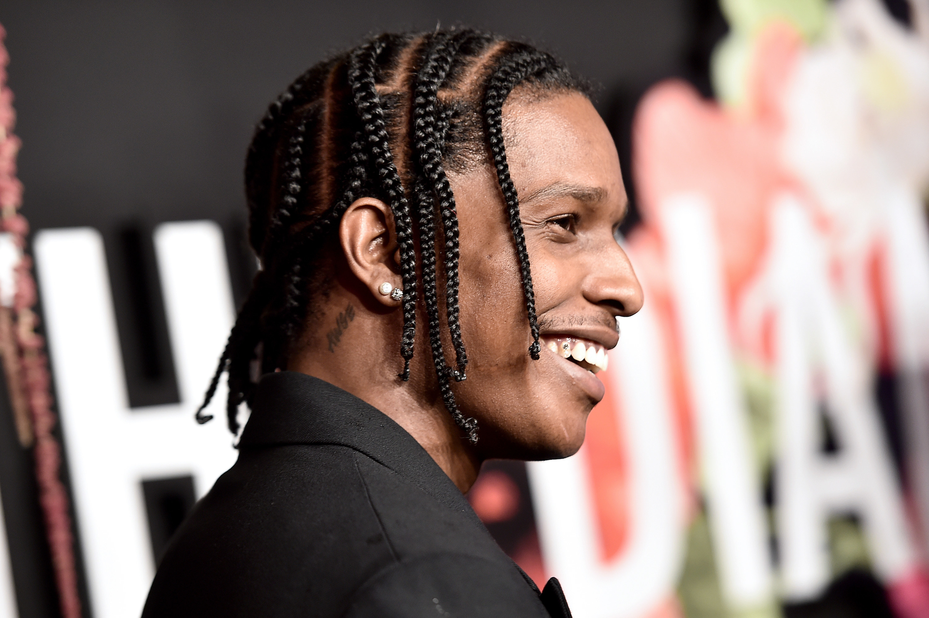 A$AP Rocky is pictured smiling at an event in 2019