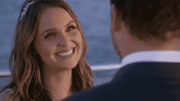 Jo and Alex smiling at each other on a ferry during their wedding on &quot;Grey&#x27;s Anatomy&quot;