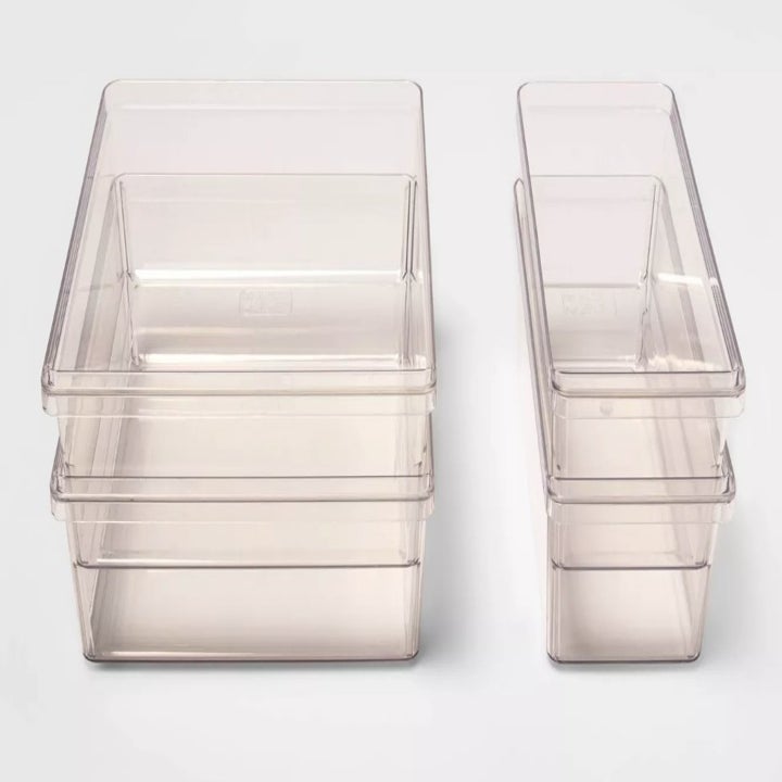 A 4 piece, plastic refrigerator storage bin set