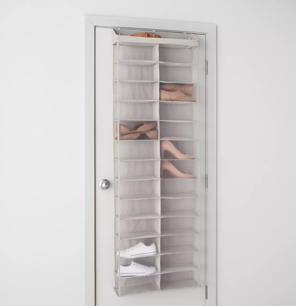 A light gray, mesh, over-the-door shoe shelf that fits 26 pairs