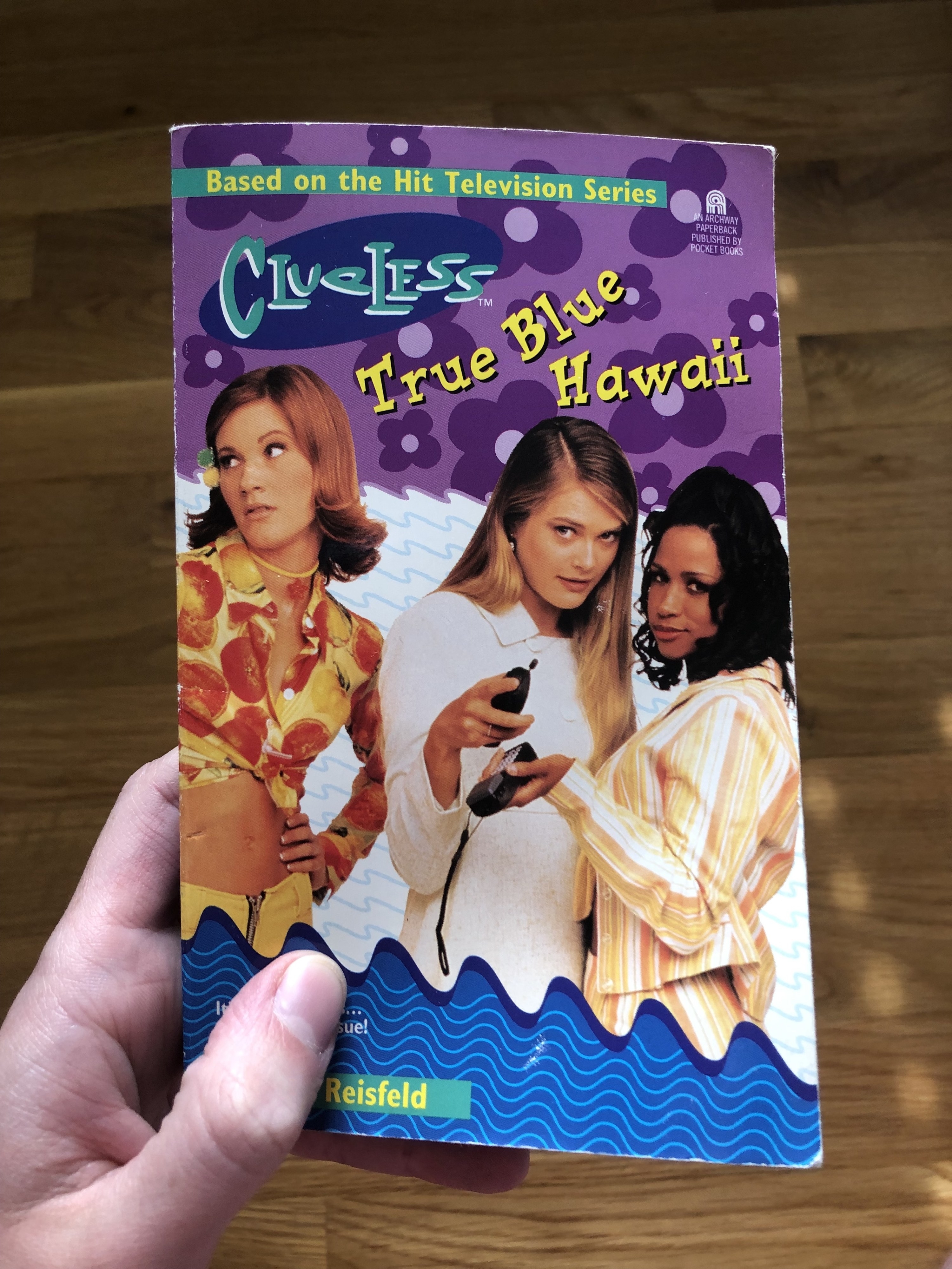 &quot;Clueless&quot; TV series actors posing for the book cover, titled: &quot;Clueless: True Blue Hawaii&quot;