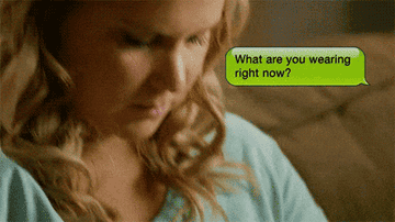 A GIF of Amy Schumer texting &quot;What are you wearing right now?&quot;
