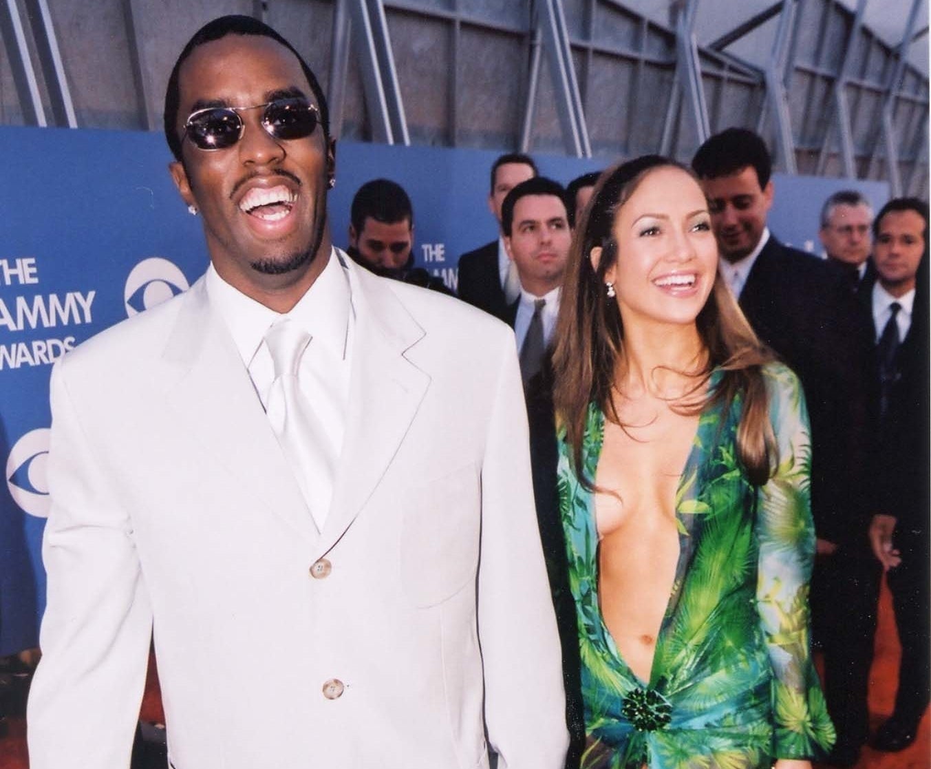 Jennifer and Diddy smile and hold hands while arriving at an award show