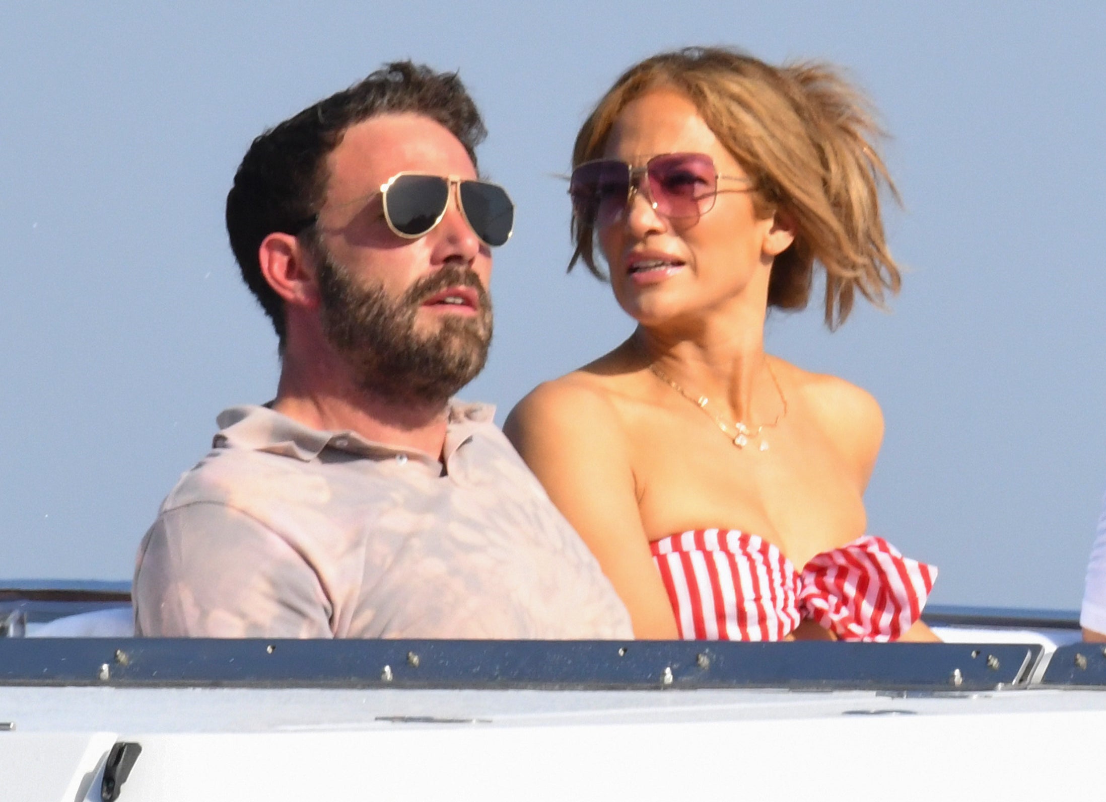 Jennifer sits on a yacht with Ben recently