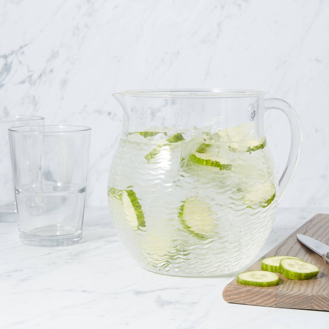 the clear textured pitcher with cucumber slices