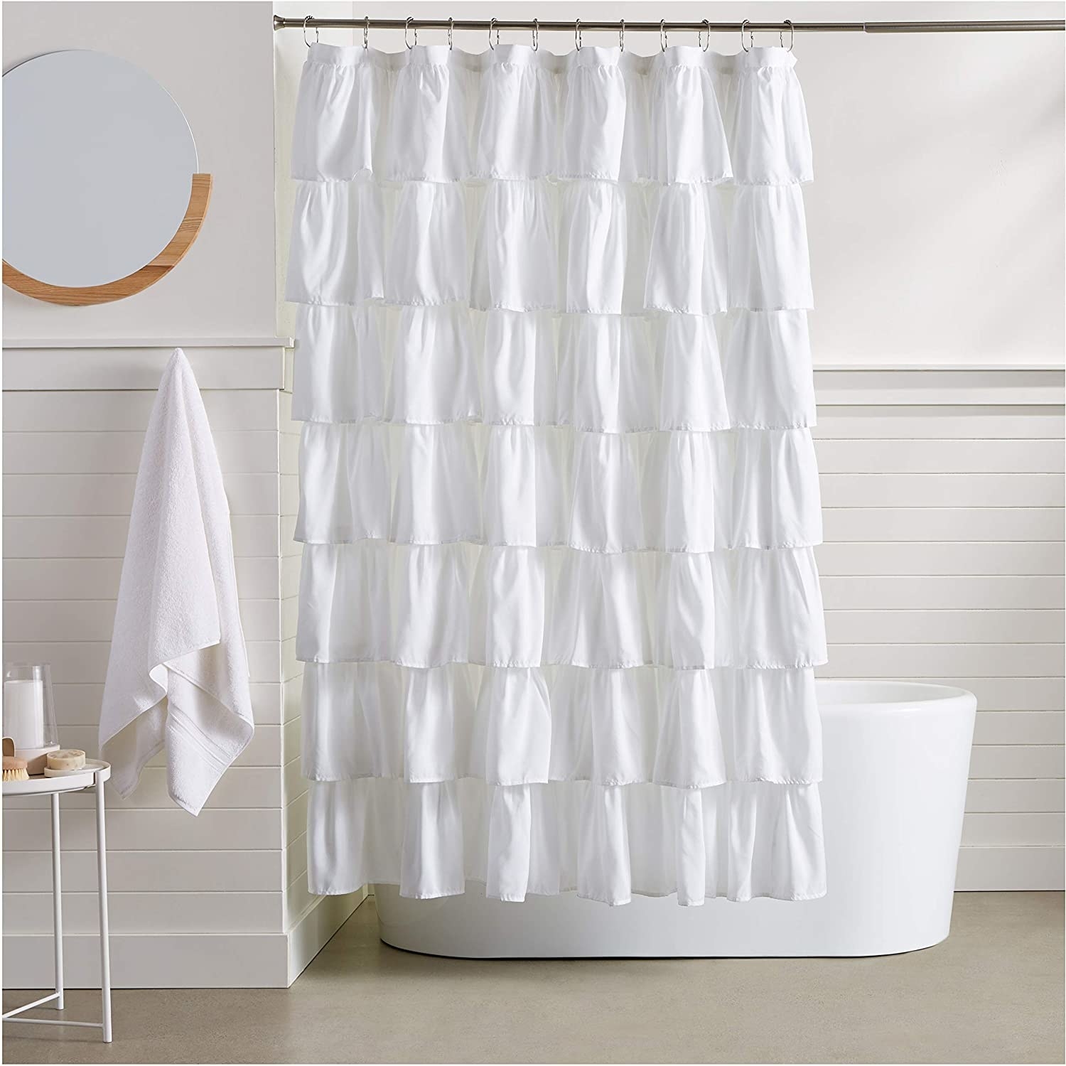 The shower curtain pulled in front of a bathtub