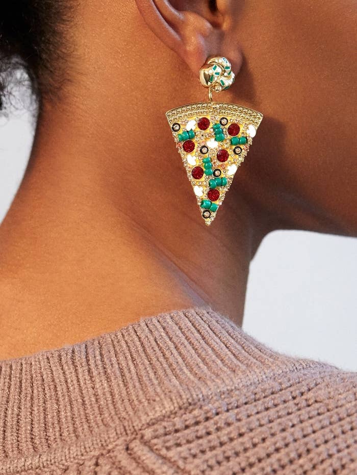 model wearing pizza-shaped earrings