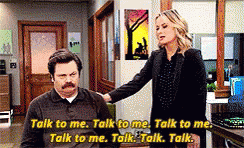 Leslie from Parks and Rec taps Ron on the shoulder repeatedly with caption &quot;Talk to me&quot; repeated