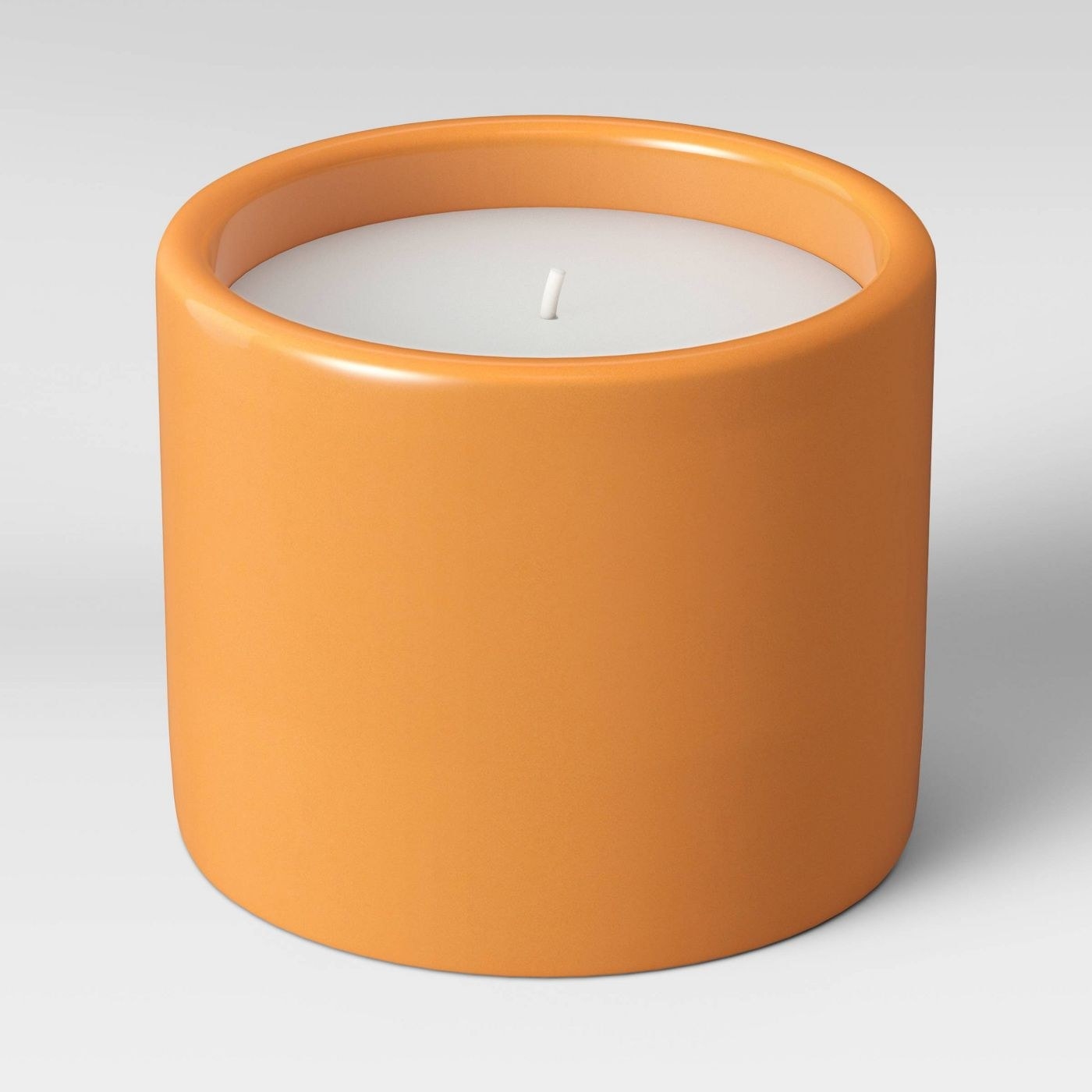 cylindrical orange candle